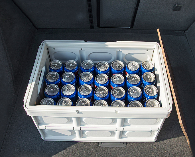 Collapsible white box filled with soda cans
