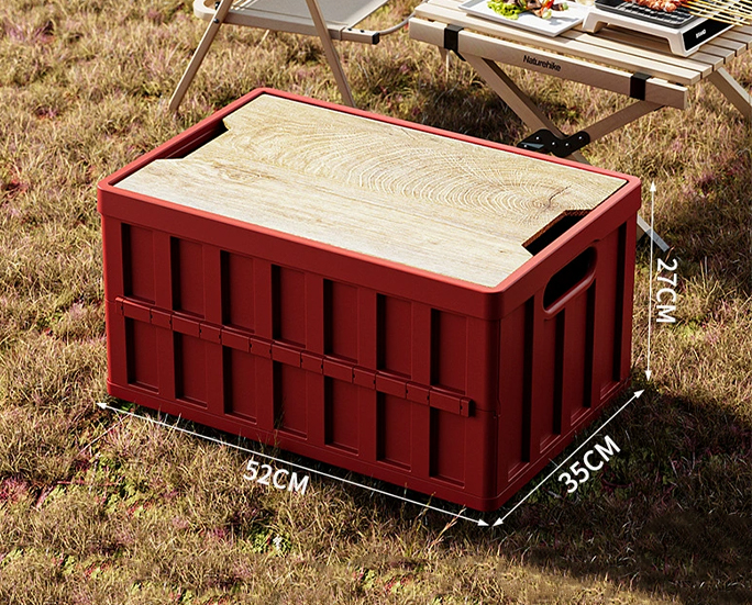 red camping folding storage box in outdoor grass or vehicle setup
