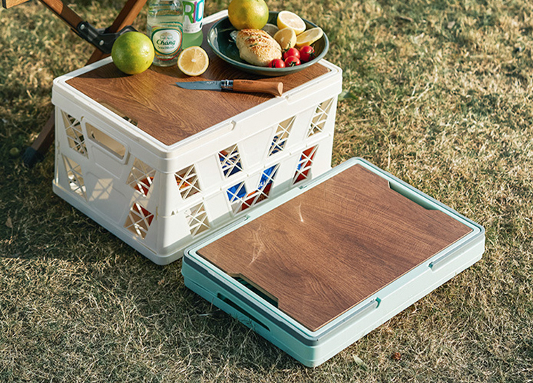 Picnic scene with white folding basket, sunflower and drinks inside