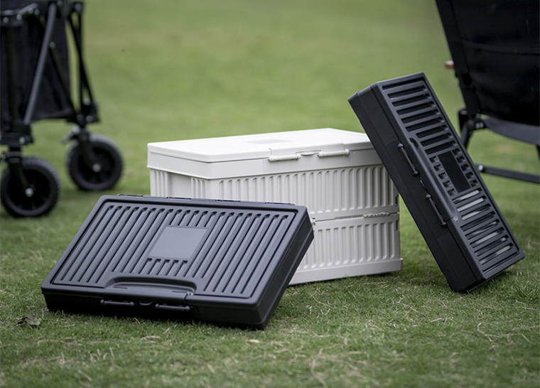White and black foldable storage boxes with lids displayed separately