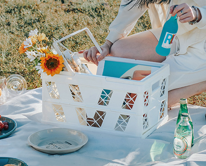 Mint green folding storage crate with wooden lid and handle