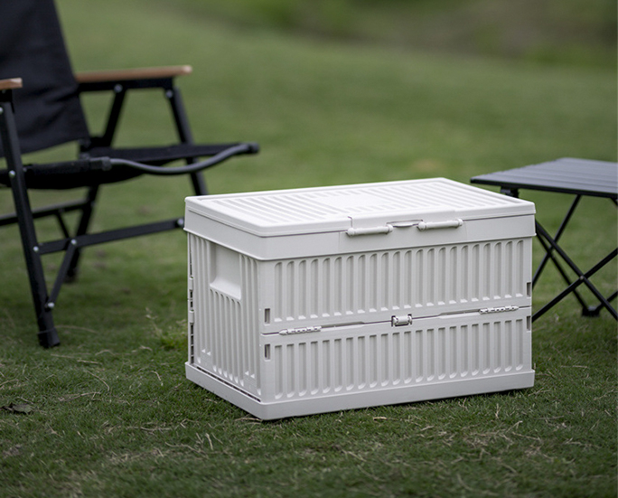 Single white collapsible camping storage box on the grass