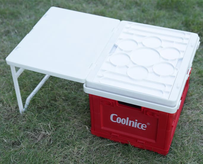Foldable storage box with integrated folding table for outdoor use