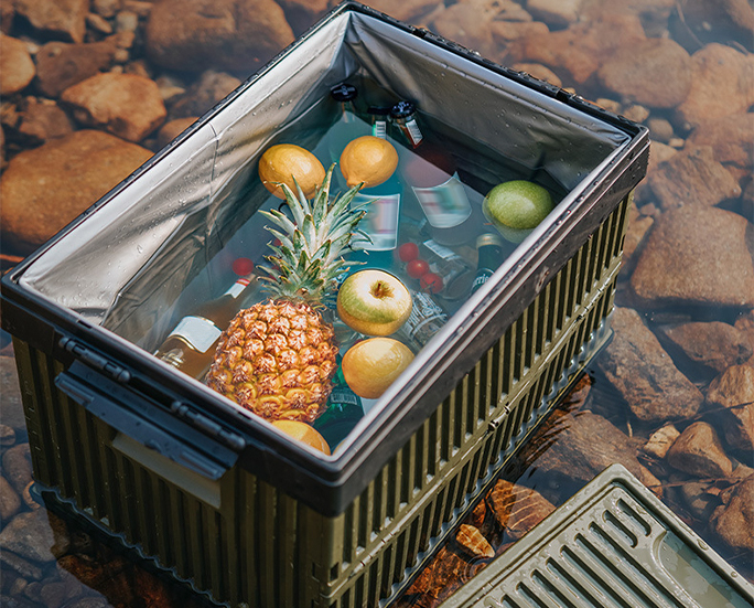 Waterproof storage box in river filled with fruits and cold drinks