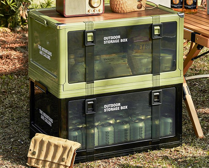 Dual stack of outdoor storage boxes filled with gear.
