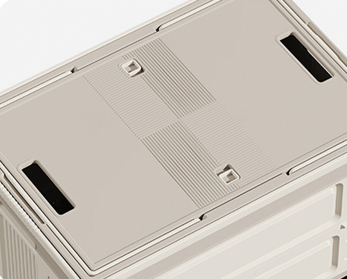 Close-up of white plastic lid with locking grooves and grip holes