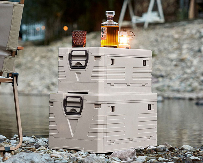 Stackable beige outdoor folding storage crates with drinks on top