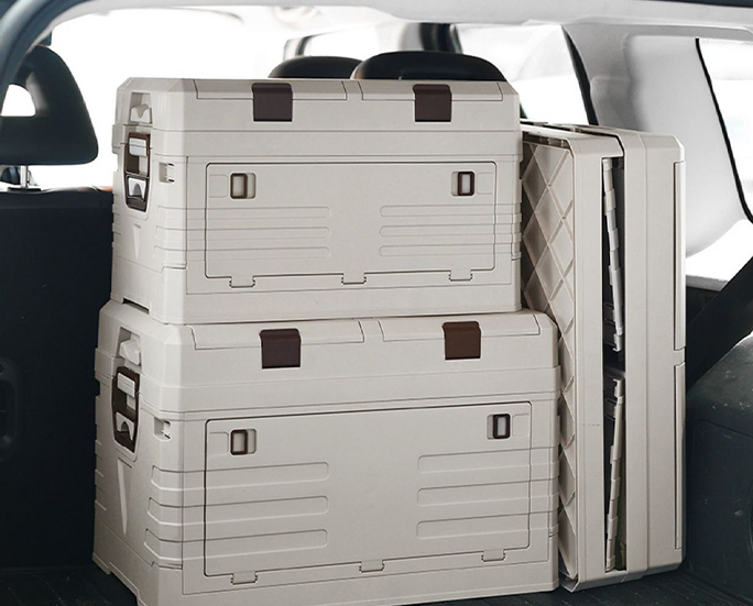 Folding crates neatly stacked and stored in vehicle trunk