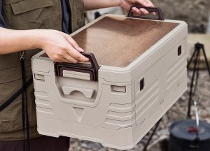 Carrying folding storage crate with integrated side handles