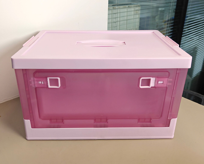 Front view of pink translucent foldable storage box with top handle